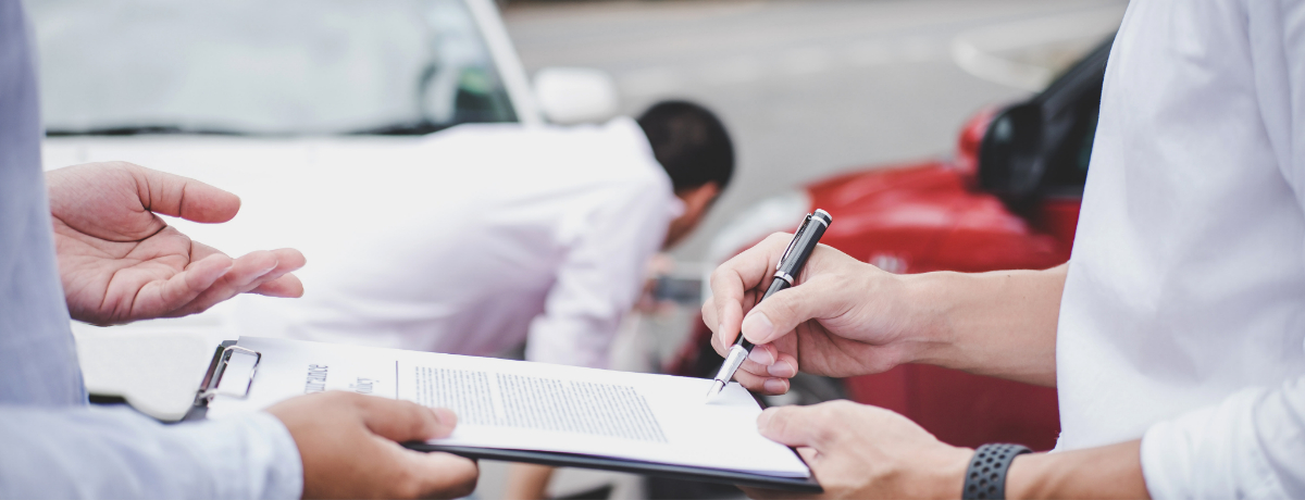 Person Receiving Form at Sight of Car Accident