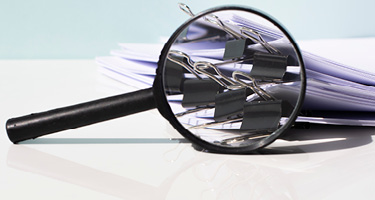 Stack of legal white papers on a desk representing thought leadership