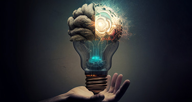 Light bulb mixed with brain being held by hand