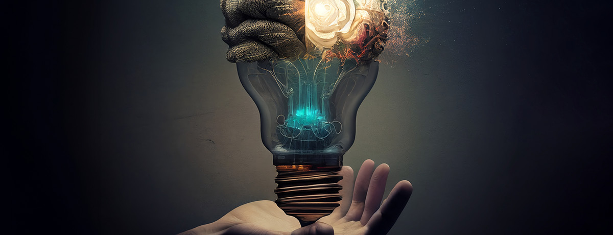 Light bulb mixed with brain being held by hand