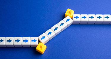 Arrows and light bulbs rising, symbolizing growth and client acquisition opportunities for law firms