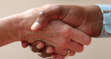 Close-up of male and female hands shaking