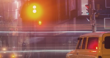 Yellow car at a stoplight