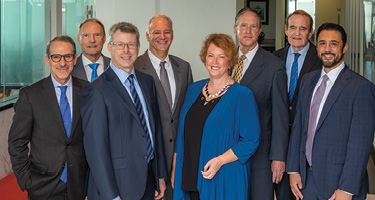 Group of lawyers pose for law firm picture