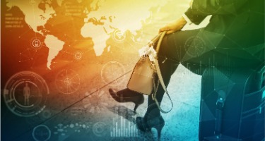 Businesswoman sits on suitcase with a filtered image of the world 