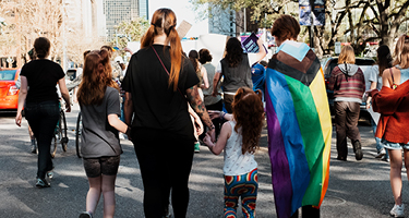 Hundreds rallied outside the Massachusetts State House pushing for the Massachusetts Parentage Act (
