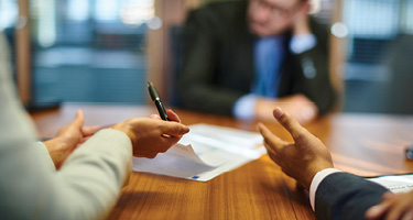 Group of individuals review contract