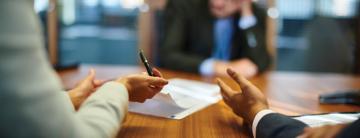 Group of individuals review contract