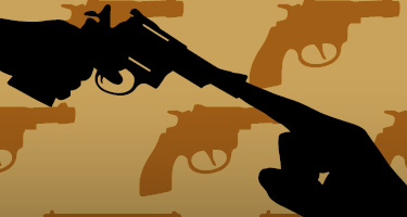 Silhouetted hand covering the barrel of a gun