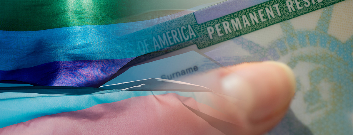 Pride flag, finger and visa document