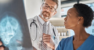 Doctor and nurse discussing an X-ray scan