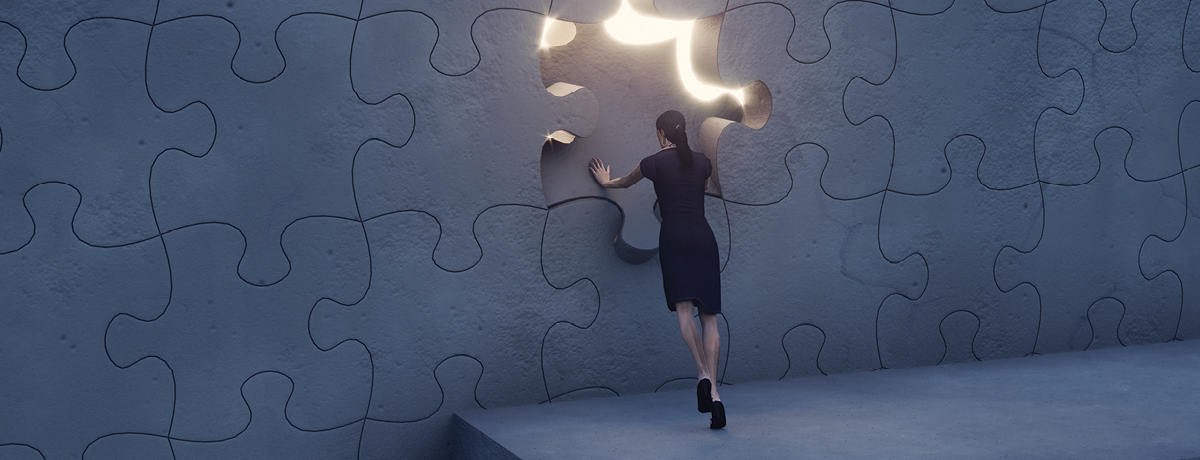 Woman in black dress pushing a glowing puzzle piece
