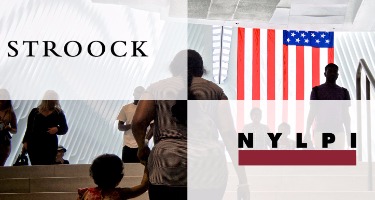 Stroock Partners with New York Lawyers with American flag in the background and people in a room