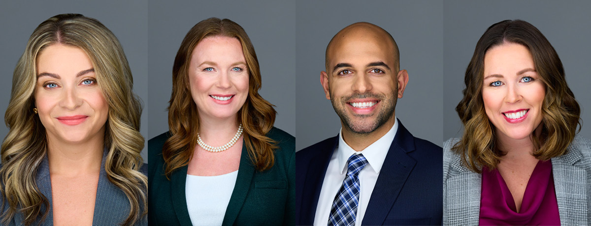 Four headshots of lawyers on grey background