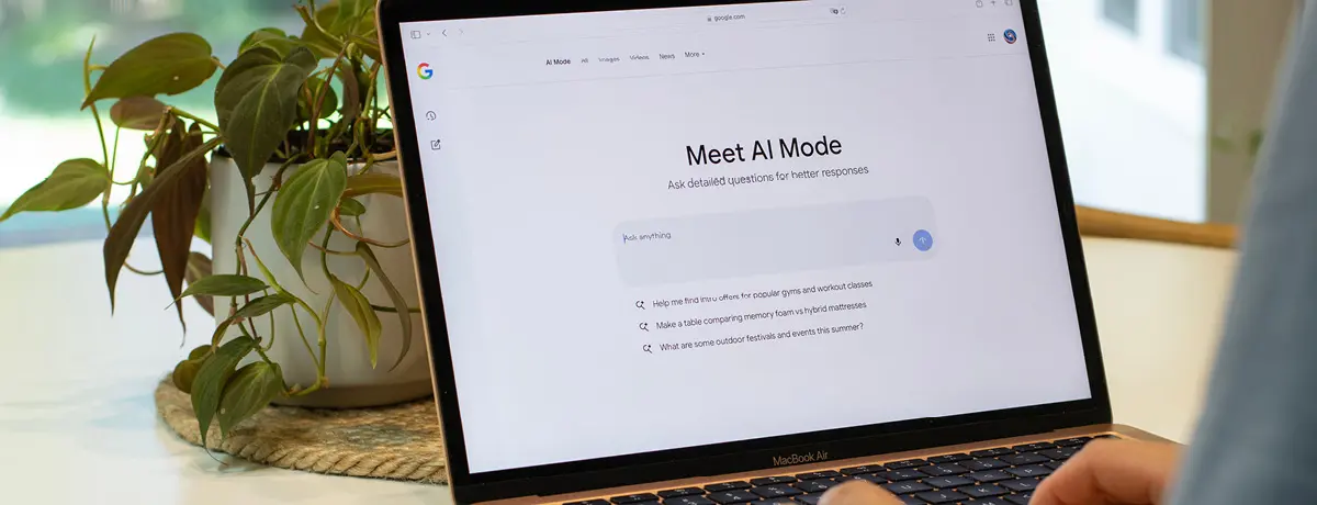 Laptop screen displaying an AI search interface