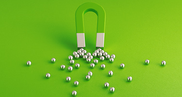 Magnet Attracting Metal Balls Symbolizing Law Firm SEO Strategy