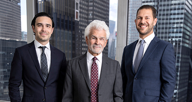 Three men in suits against New York skyline 