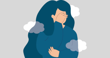 Cartoon of woman in blue shirt and hair covering her face