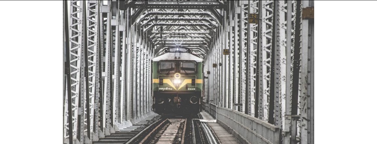 Train approaching on railway tracks.
