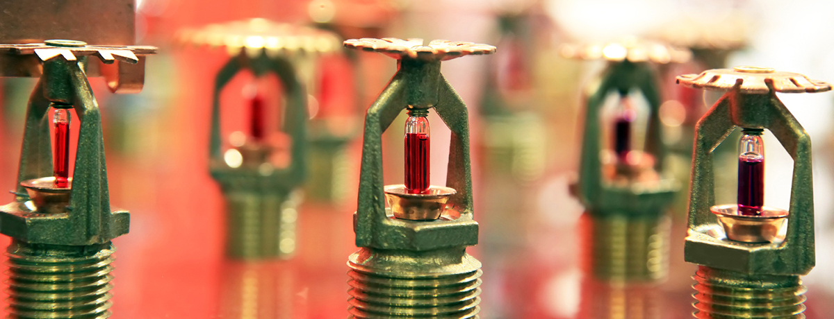 Gold Indoor Sprinkler Heads on Red Background