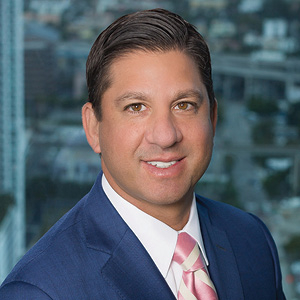 Lawyer in suit smiles for professional headshot