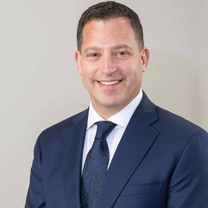 Lawyer in suit poses for a headshot photo