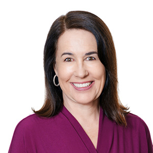 Lawyer poses for legal headshot in purple dress