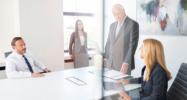 Four Sugarman Attorneys in Conference Room