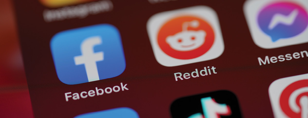 Phone background showing various social media apps