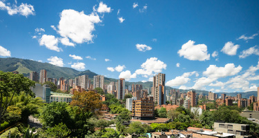 Cityscape of Colombia with blue cloudy sky above