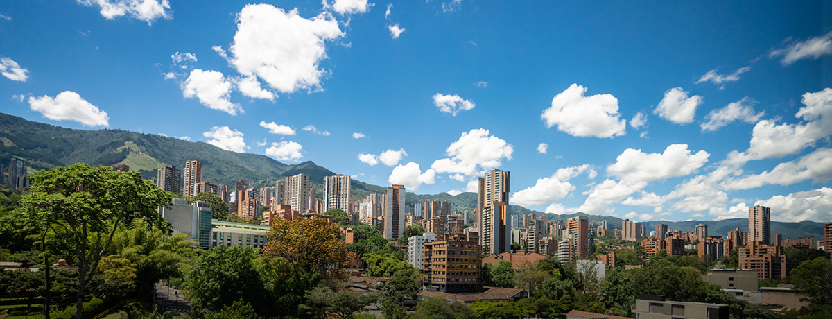 Cityscape of Colombia with blue cloudy sky above