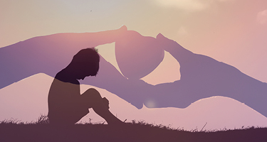 Dark silhouette sits with hands holding heart in backdrop