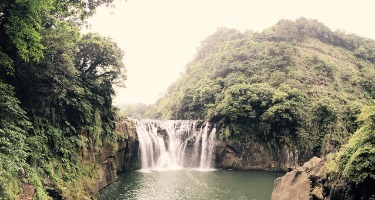 Waterfall in tropical jungle.