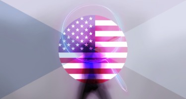 Blurred man walks past circle of American flag and magnifying glass 