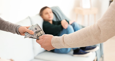 Two parents exchange money for child support 