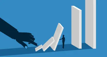 A silhouette of a large hand pushing over a row of falling dominos toward a small figure standing be