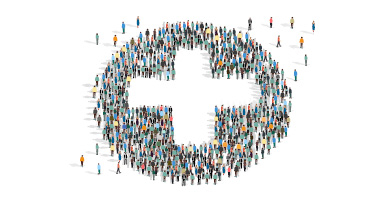 People forming a circle with white cross in center