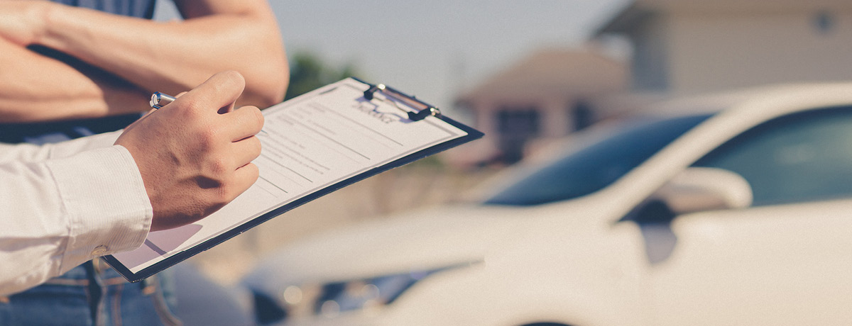 Person taking details related to a car accident
