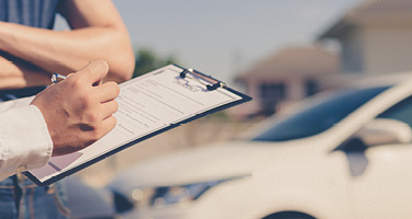 Person taking details related to a car accident