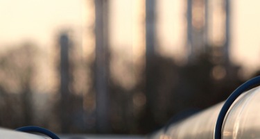 Silver Gas Pipe connecting to a group of oil pipes 