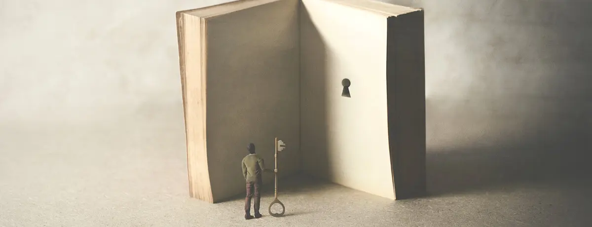 Figure stands before an open giant book, holding a large key, facing a keyhole on the inner page. 