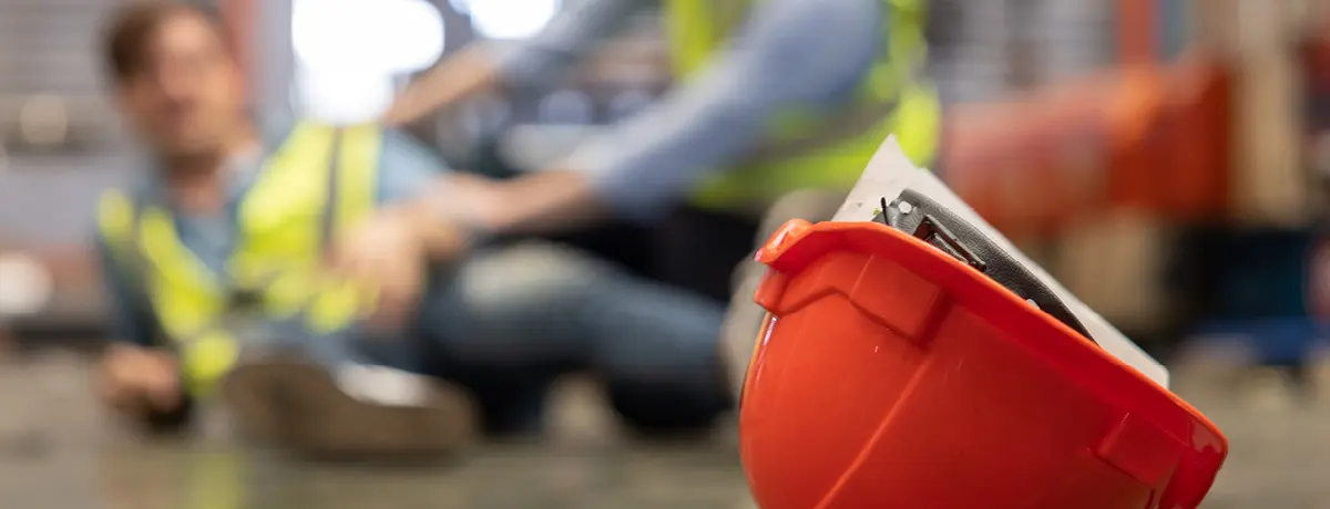 Injured worker receiving medical attention at workplace