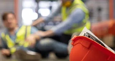 Injured worker receiving medical attention at workplace