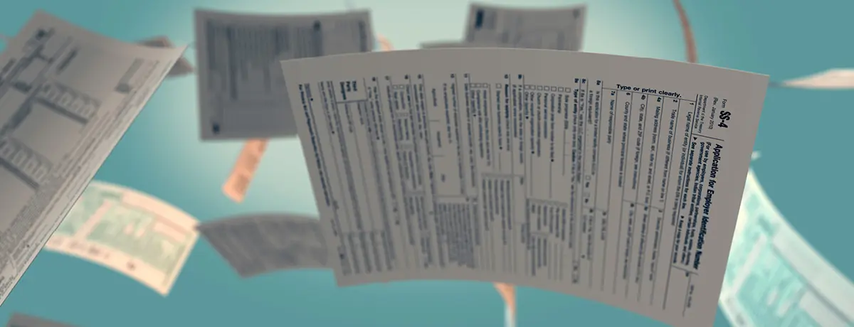 Flying tax documents symbolizing the stress and urgency of mortgage and foreclosure-related paperwor