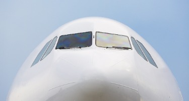 Airplane with blue background and windows