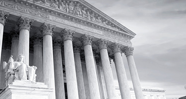Court house in black and white cloudy sky