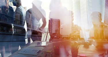 Corporate Professionals Overlaid with skyscrapers. 