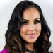Headshot of woman with long dark hair